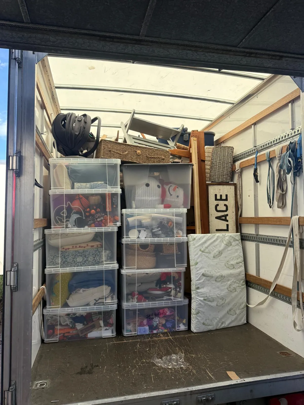 Boxes and a bed prepared for a student house move in Huddersfield